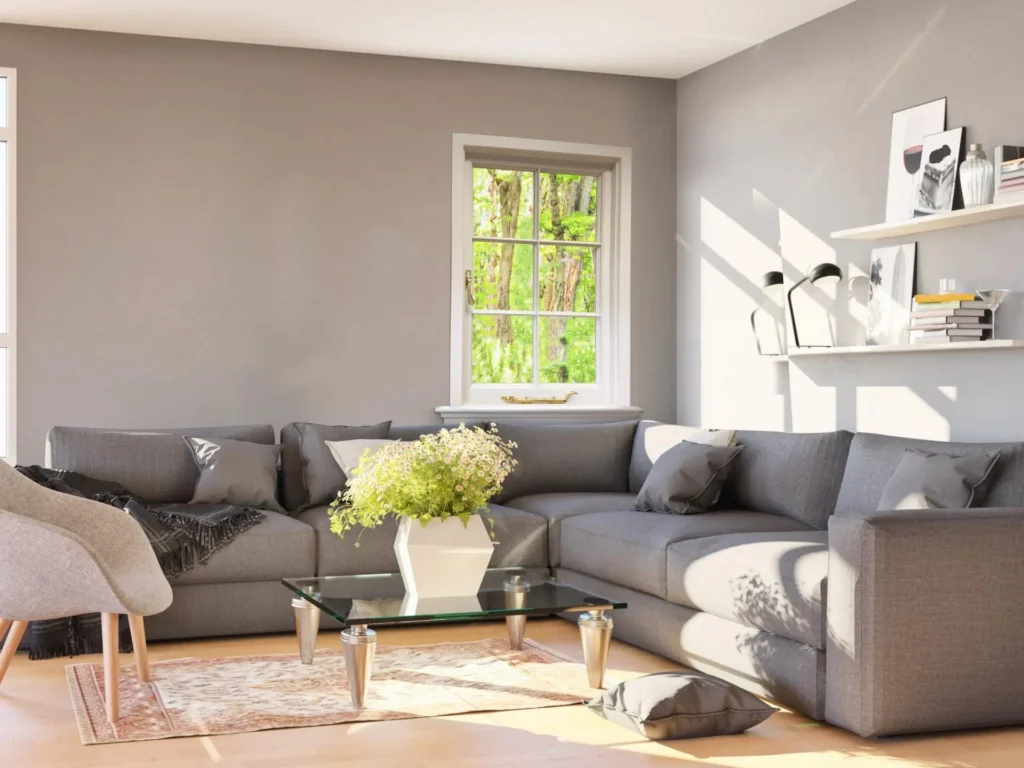 Richmond heritage flush casement window with slim glazing bars in a bright, modern living room featuring a grey corner sofa and minimalist decor.